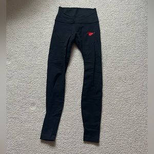 Black Lululemon Leggings with mustang patch on hip
